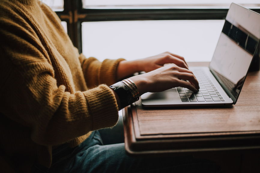 Woman On Laptop Side View