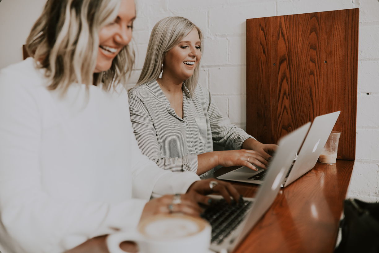 2 Happy Customers On Laptops